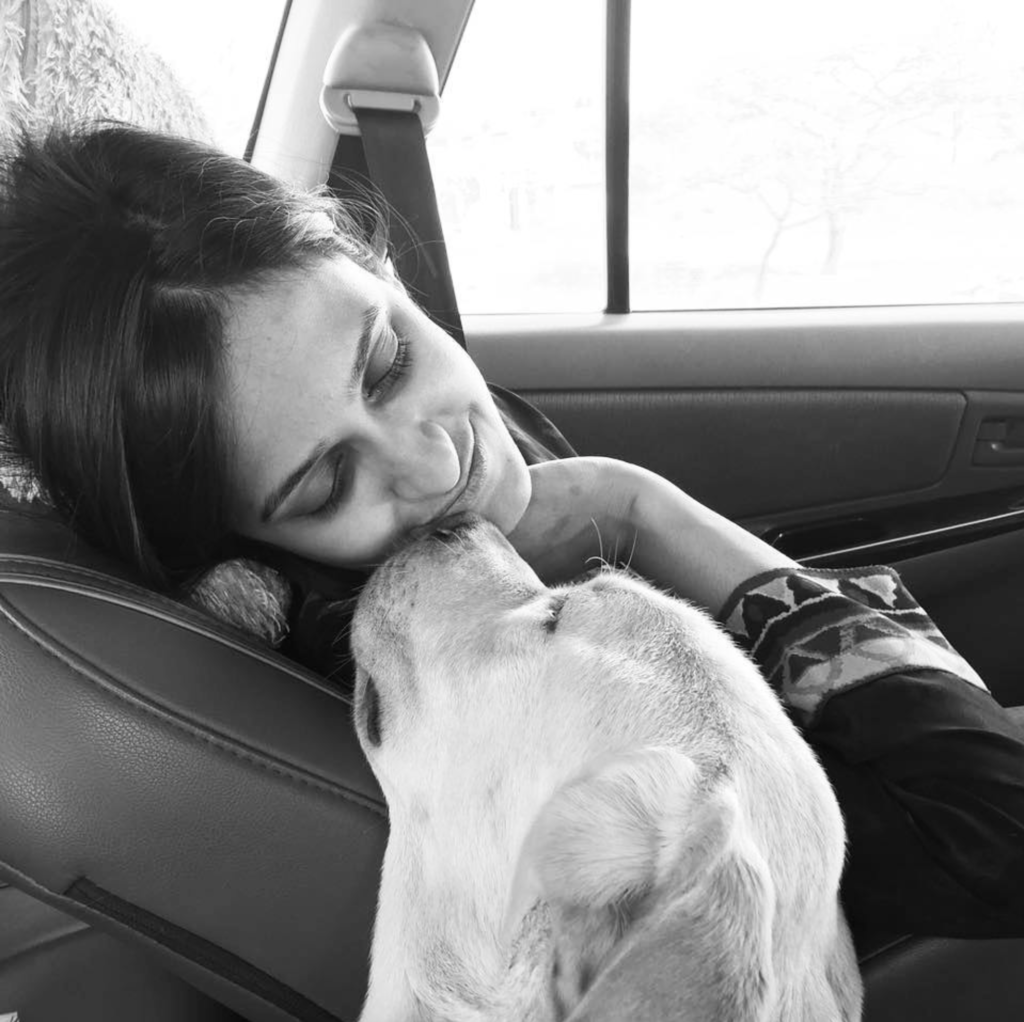 Sneha With Fido, Travelling in a Car. This image is giving the warmth we both have which is perfect for About Us page of the website. 